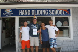 Bruce Weaver and team at Kitty Hawk Kites Hang Gliding School with TripAdvisor Award