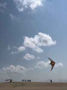 Flying a dual line stunt kite at Jockeys Ridge State Park