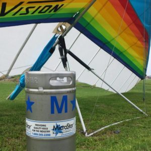 A keg next to his soon to be best friend, a hang glider