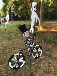 A skeleton spinner with ghostly wind socks behind it