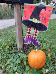 a halloween style flag and a pumpkin