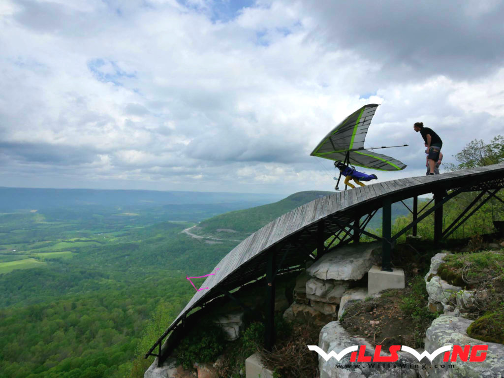 Sara Weaver launching her hang glider from Henson's Gap