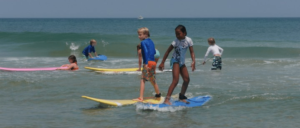 Kids learning how to surf