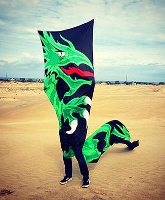 dragon kite covering person