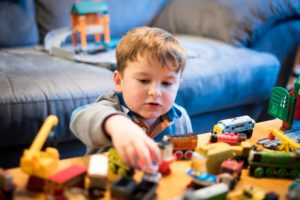 Boy playing with toys indoors